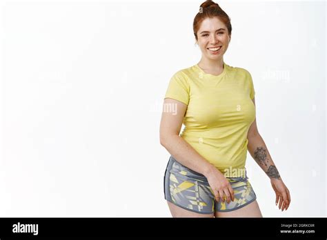 Portrait Of Smiling Chubby Redhead Young Woman Portrait Of。